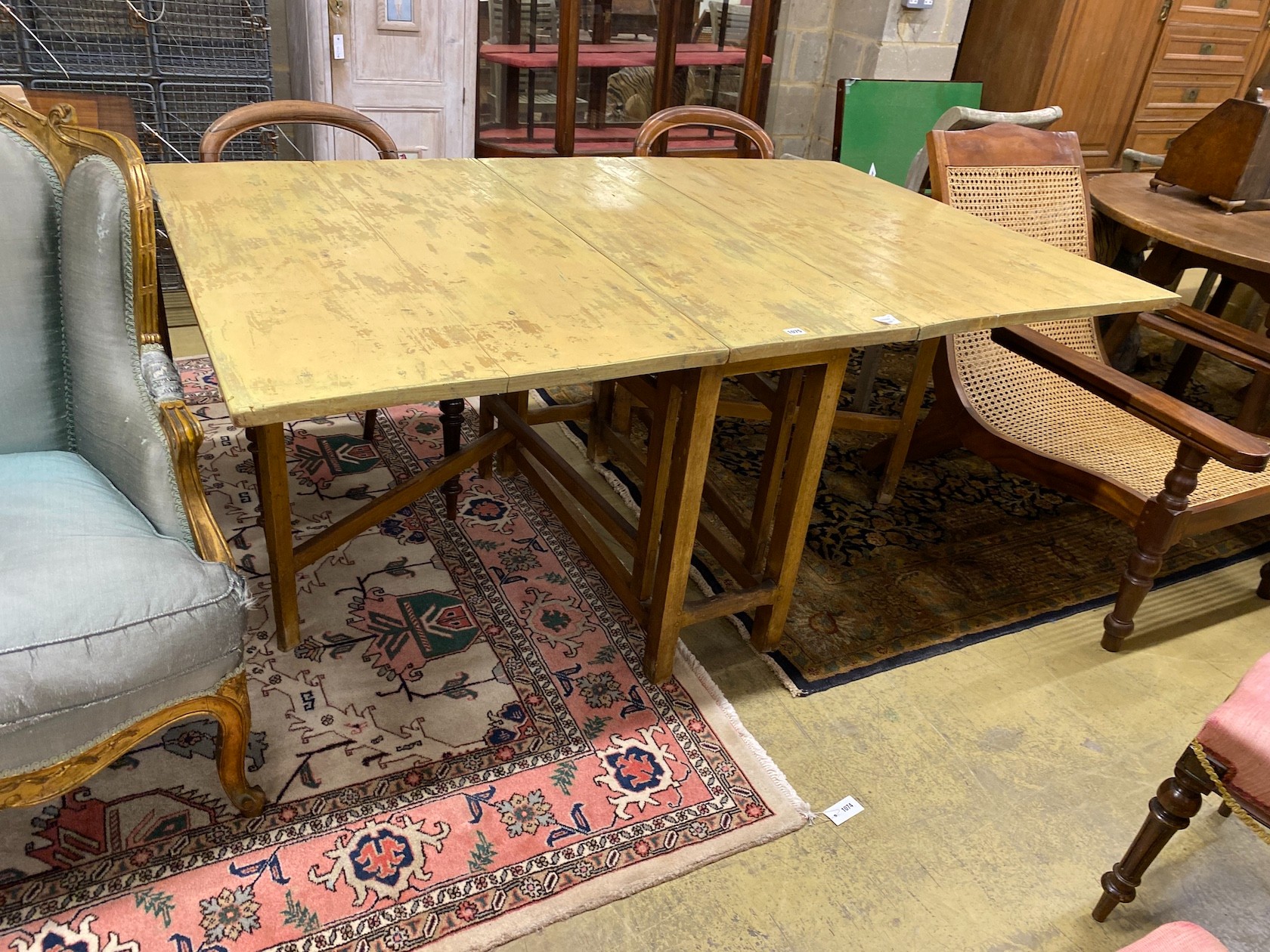 An early 19th century Swedish drop leaf dining table, length 173cm extended, depth 110cm, height 78cm